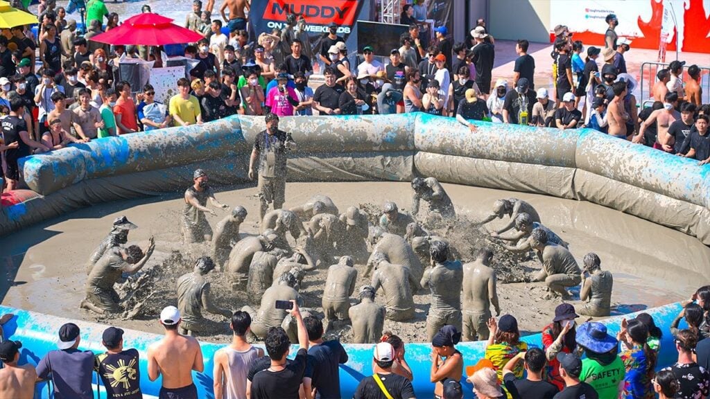 20 amusing activities for Seoul in Summer 2024 11 Group of people having fun on the muddy ground in celebration of Boryeong Mud Festival