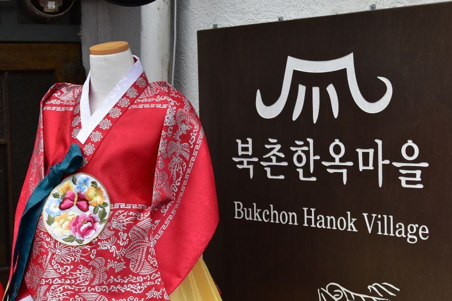 What To See And Do in Bukchon Hanok Village Seoul In 2024 22 Bukchon Hanok Village Sign with Korean Hanbok