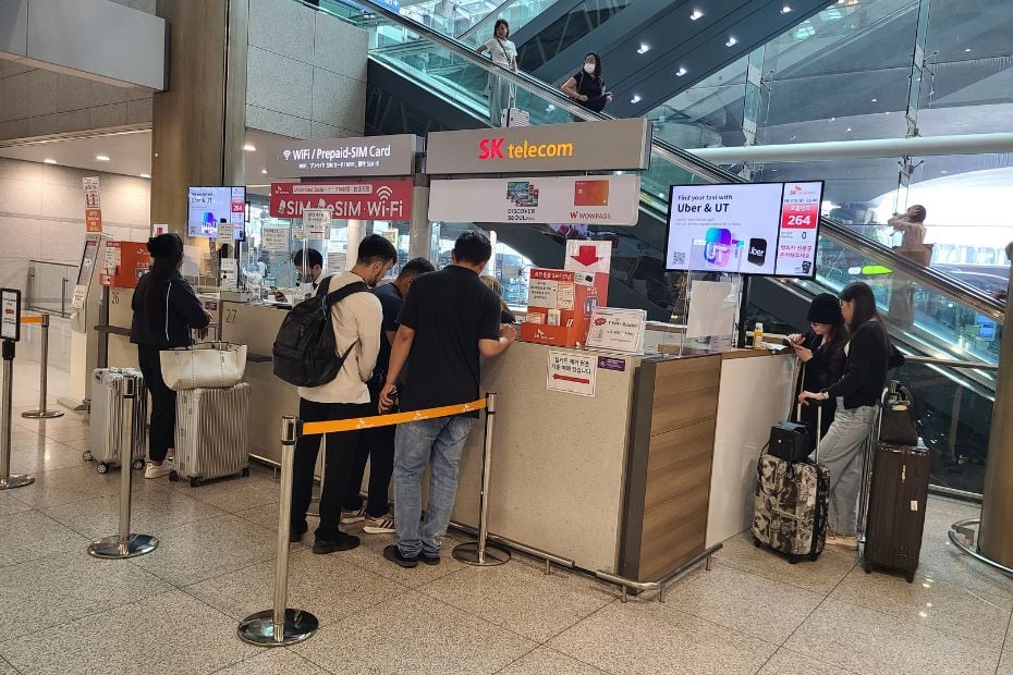 Korean SIM Cards And Tourist ESIMs At Incheon Airport 2024 11 People buying a SIM card at Incheon Airport