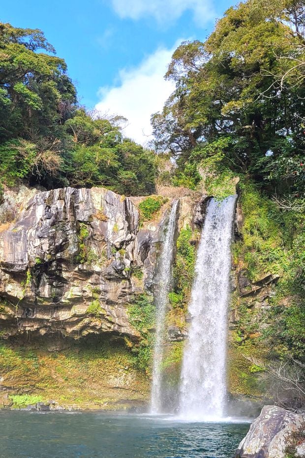 What To Do On Jeju Island In Winter: Jeju Winter Itinerary 2024 23 Cheonjiyeon Falls near Seogwipo on Jeju Island