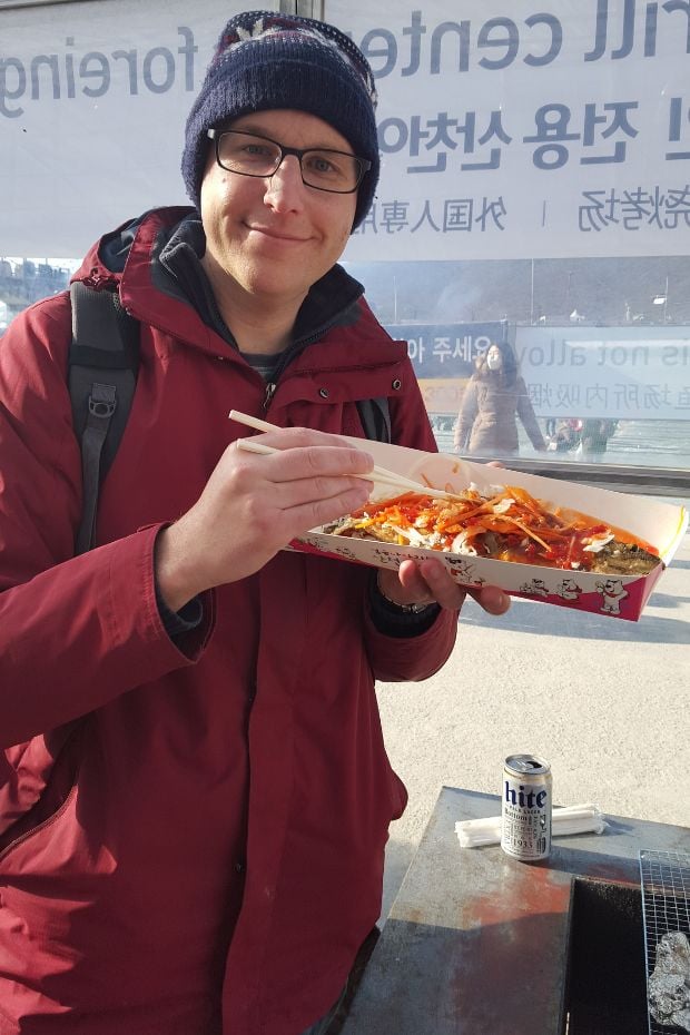 The Best Winter Festivals In Korea You Must Visit In 2024 8 Eating fish at the Hwacheon Ice Fishing Festival in Korea