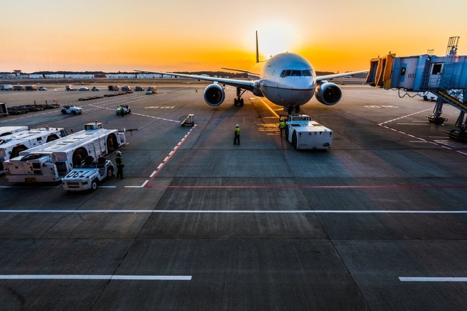 Flying To Korea: How To Get Cheap Flights To Korea In 2024 14 Flight connecting at an airport at sunset