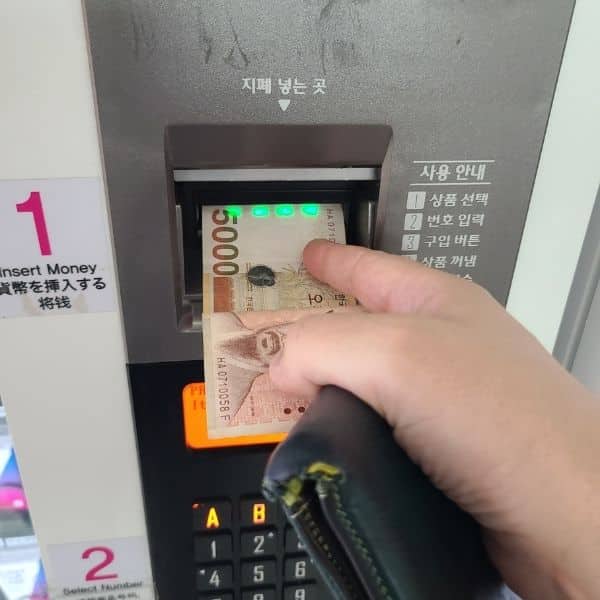 Korea's T-Money Card: The Ultimate Guide 2024 8 Inserting money to buy a T-Money Card