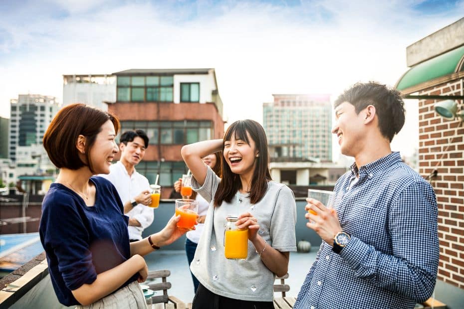 Move to Korea To Teach English: 8 Tips To Help You Settle Into Korea 6 Korean people drinking on a rooftop