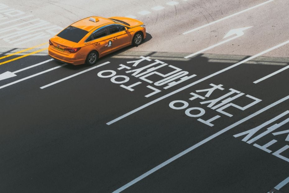 How To Get A Taxi In Korea: Hailing Or Booking A Taxi 2024 5 Korean tourist taxi on road with Korean markings