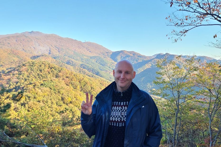 Korea In October 2024: Best Festivals, Events, And Sights 8 Man exploring Korean mountains during autumn