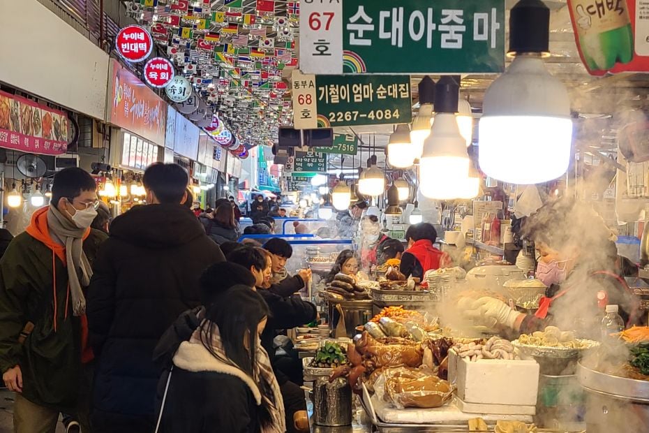 10 Best Traditional Markets In Korea For Food And Shopping 4 People at a Korean traditional market in Seoul