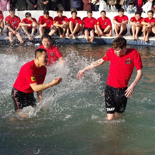 Hwacheon Sancheoneo Ice Festival 2024: Korean Ice Fishing Fun 8 People in ice cold water at Ice Festival in Korea