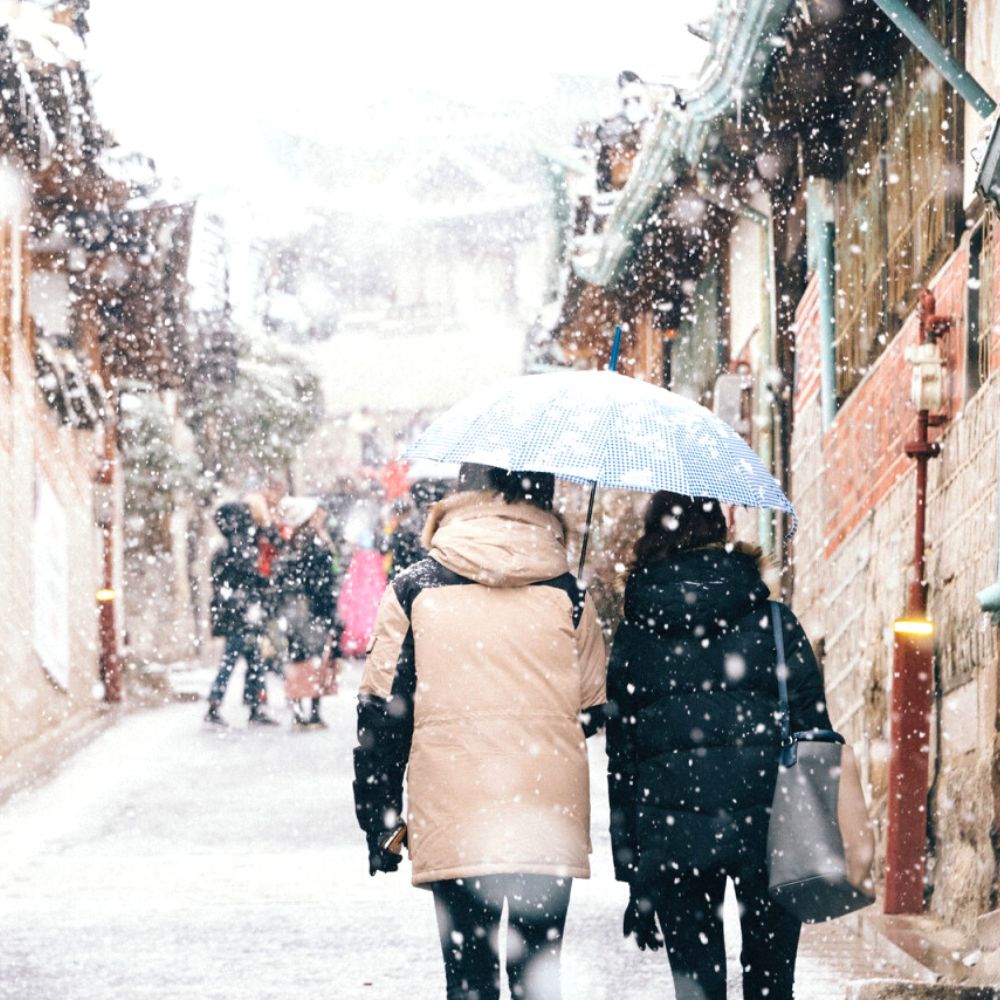 Where Does It Snow In Korea? Snow In Seoul And Korea 2024 9 People walking in snow in Bukchon Hanok Village Seoul