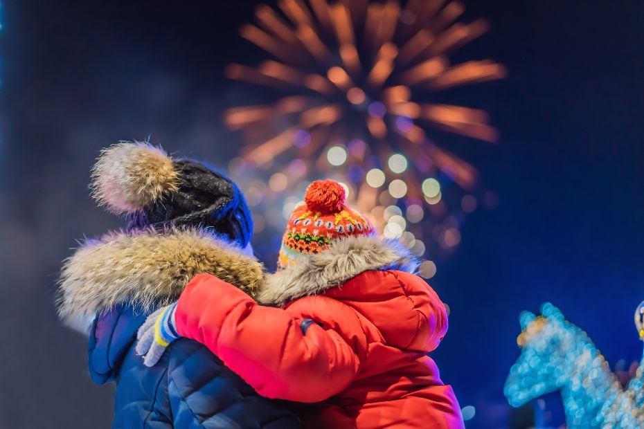 The Best Winter Festivals In Korea You Must Visit In 2024 4 People watching fireworks at winter festivals in Korea