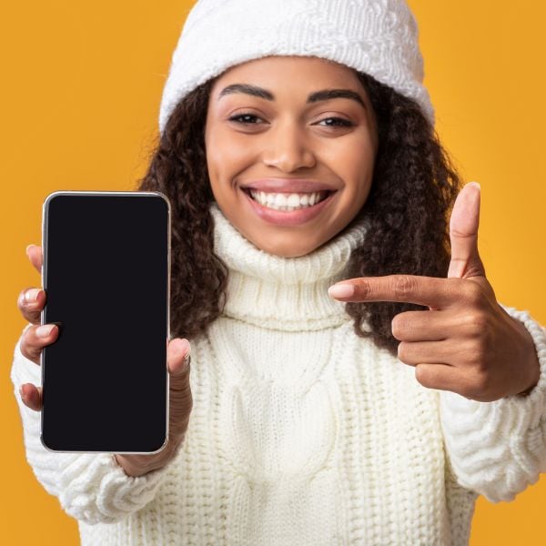 Person holding a cell phone Person holding a cell phone