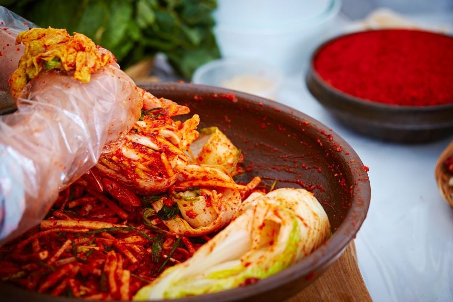 I Tried Kimjang! Korean Kimchi Making Day Is Tough But Fun 9 Person making kimchi on gimjang