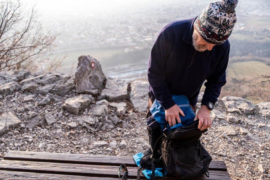 How To Hike Bukhansan Baegundae Peak: Seoul's Best Hike 2024 47 Person packing hiking equipment on a mountain