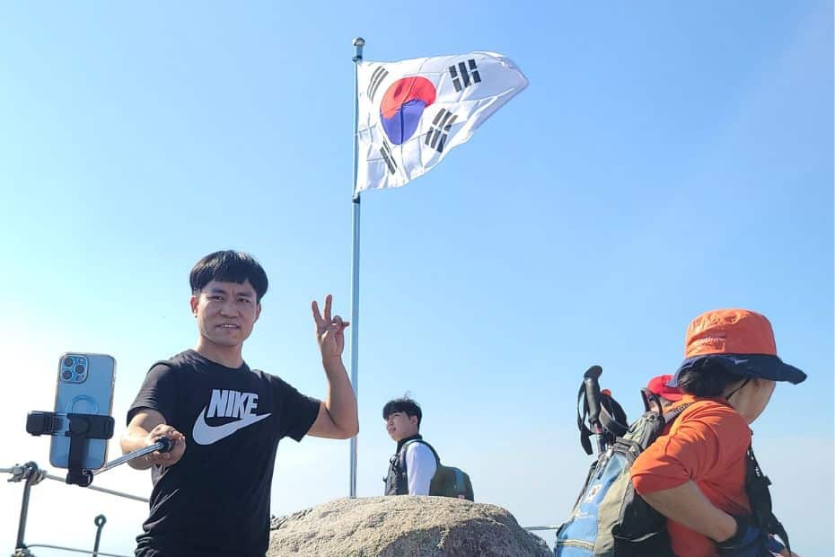 How To Hike Bukhansan Baegundae Peak: Seoul's Best Hike 2024 42 Person taking a selfie at Baegundae Peak