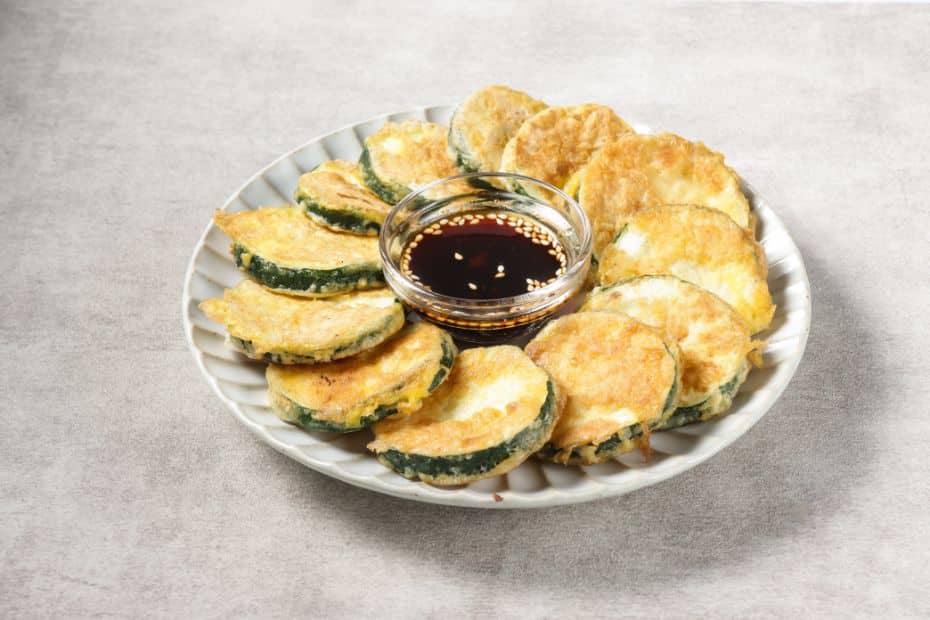 10 Best Korean Side Dishes: Banchan You Can Make At Home 26 Plate of hobak jeon Korean side dish of fried zucchini