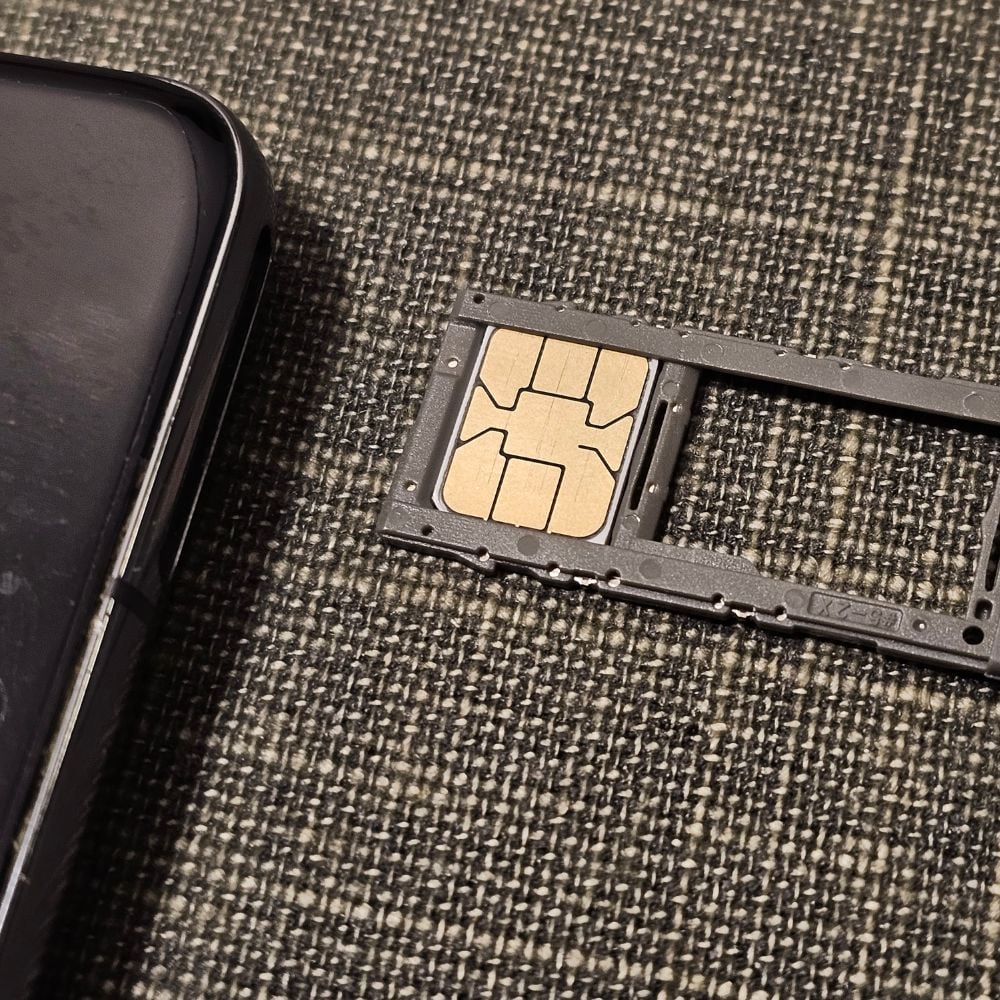 4G SK SIM Card Review: The Best Korean SIM For Tourists 2024 17 SK SIM Card being inserted into phone