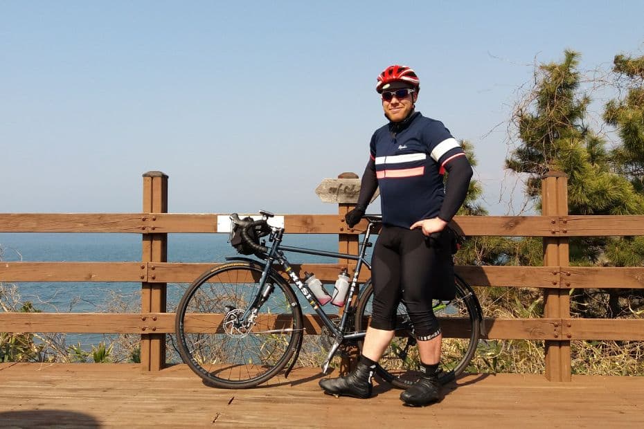 15 Best Places To Go Cycling In Korea: From Coast To Mountains 6 Tim with his bike cycling in Korea