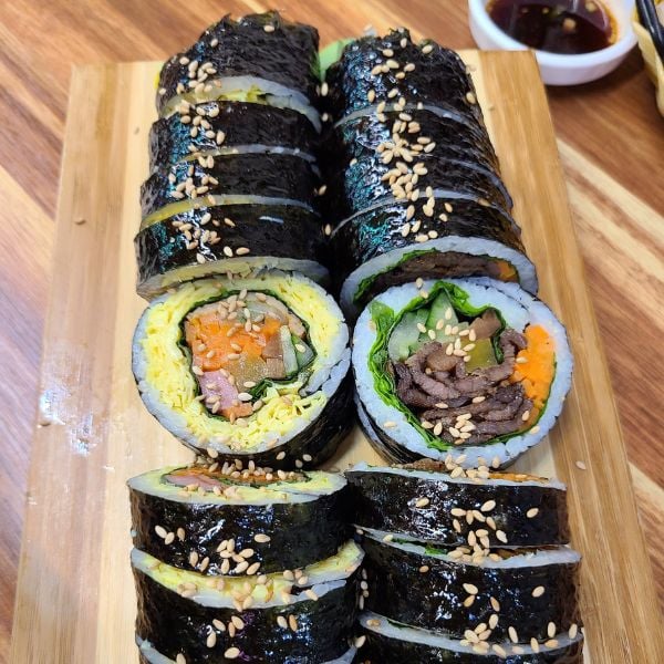 Two gimbap rolls with various fillings Two gimbap rolls with various fillings