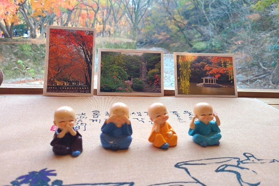 How To Go To Naejangsan National Park For Fall Foliage 2024 16 Buddha statues and postcards in a cafe in Korea