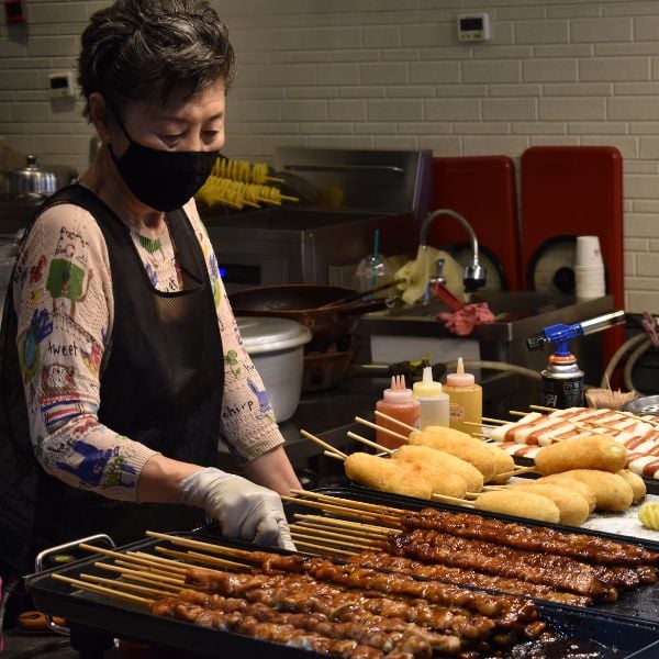 Woman cooking Korean street food Woman cooking Korean street food