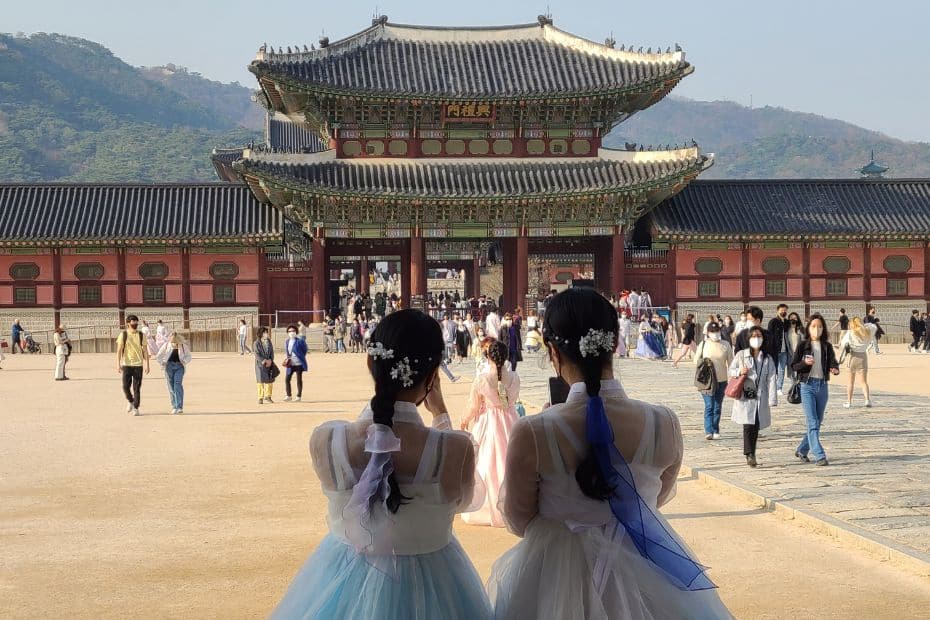 Complete South Korea Travel Guide 2024: Korean Travel Tips 12 Women in hanbok at Korean palace in Seoul