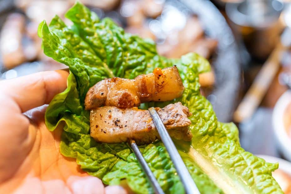How To Order Food In Korean: Useful Korean Restaurant Phrases 18 Wrapping up Korean BBQ in a lettuce leaf