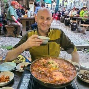 Joel eating Korean food
