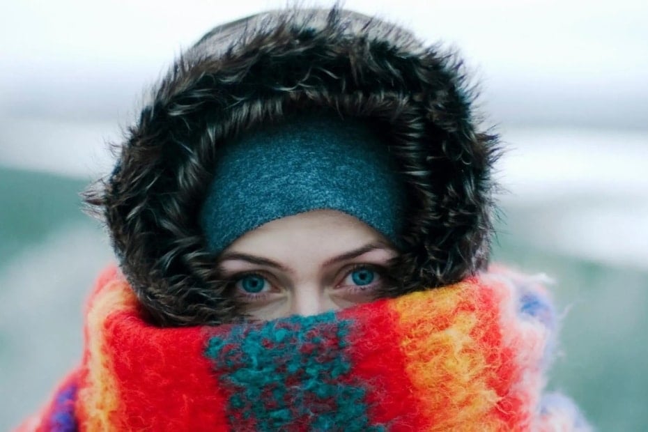 A Guide To Winter In Korea 2024: 20+ Best Winter Activities 24 Woman wrapped up warm in winter